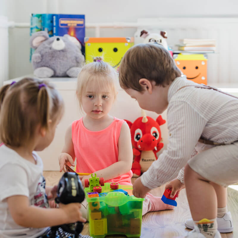 children-playing-with-toys-floor (1)