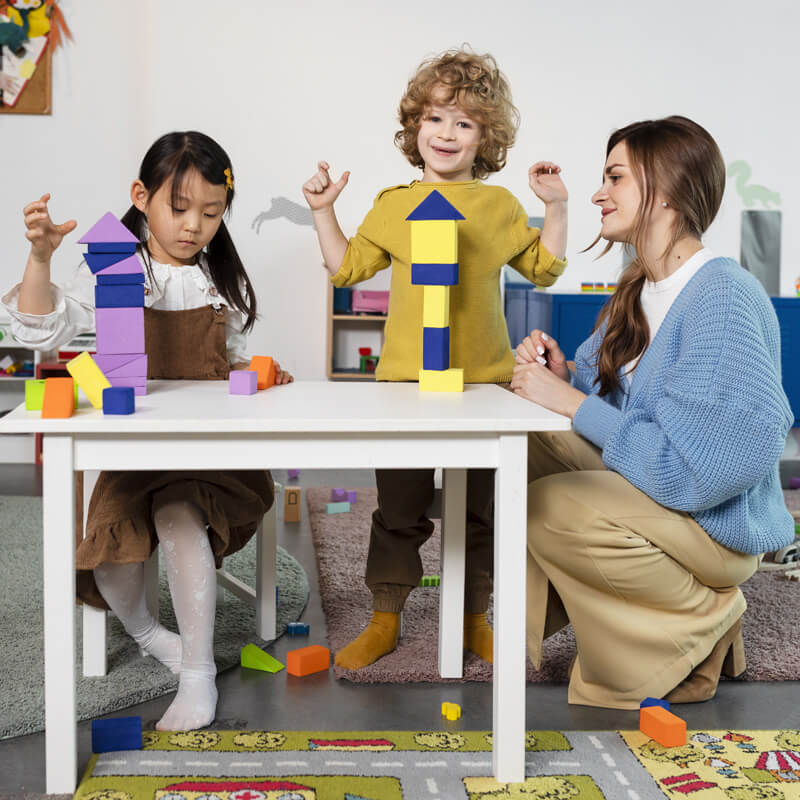 full-shot-kids-playing-with-wooden-shapes (1)
